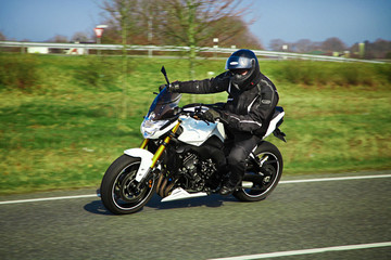 Motorcyclist biker on the road
