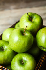 fruit. apples in a basket on wooden table