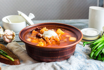 red borscht with sour cream, wild garlic, black bread, dinner
