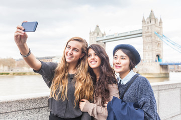 Multiracial group of girls taking a selfie in London