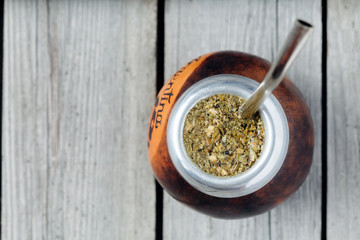 Healthy yerba mate tea  kalabash with bombilla in rustic style
