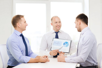 Fototapeta premium smiling businessmen with papers in office
