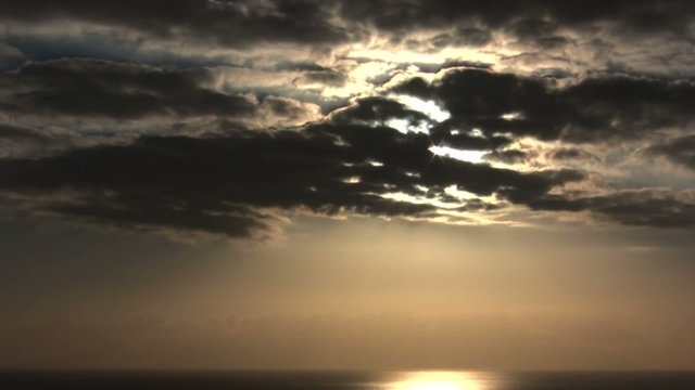 Dramatic clouds time lapse sunset with warm light