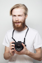 Fototapeta premium bearded man with a digital camera