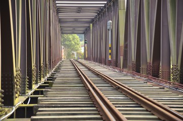 Fototapeta premium The close view of railroad track on iron bridge