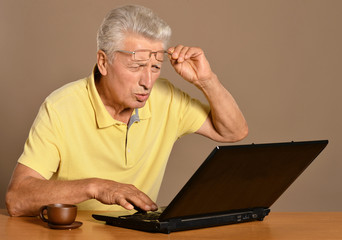 man sitting with laptop