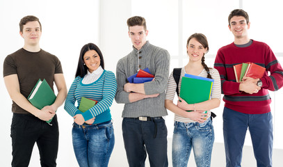 Group Of Smiling Students With Books