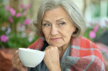 Senior woman with cup