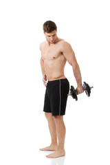 Fototapeta premium Muscular sports man weightlifting.