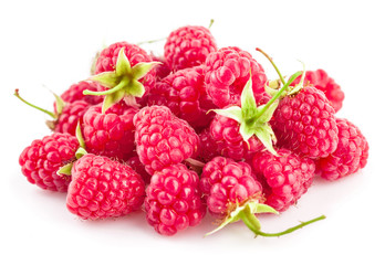 Fresh berry raspberries with green leaves. Isolated on white