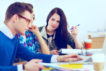 Young business people working at office on new project