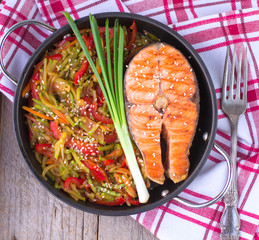 Salmon steak with vegetables
