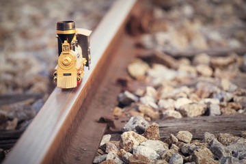 Vintage train toy model on rail.