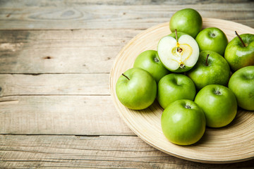 fruit. apples in a bowl on wooden background