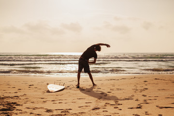 surfer man fitness on the beach