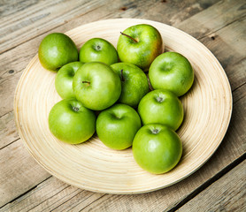 fruit. apples in a bowl on wooden background