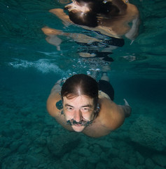 Swimmer underwater with open eyes