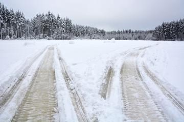 A pair of Snowmobile tracks on the frozen lake