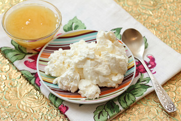 Still-life with fresh cottage cheese and honey.