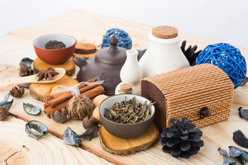 dry tea leaves cinnamon and on wooden background