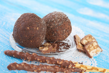 Cupcake with chocolate on wooden background