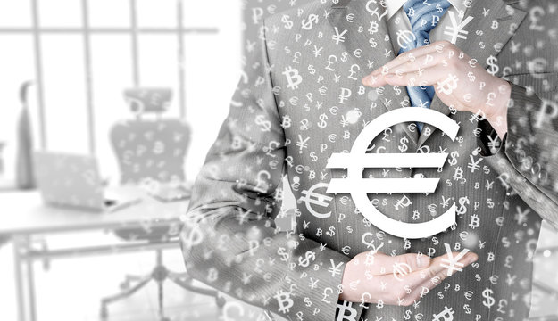 businessman protecting euro symbol