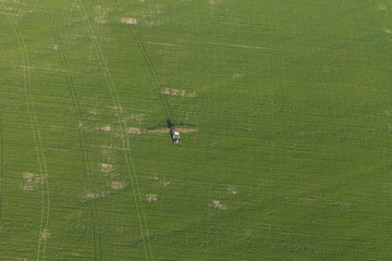 aerial view of harvest fields with tractor
