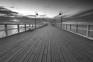Beautiful long exposure seascape with wooden pier - obrazy, fototapety, plakaty