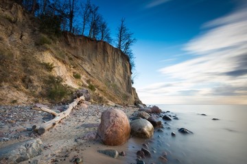 Beautiful cliff on sea shore. Long exposure photo