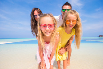 Portrait of beautiful family during summer tropical vacation
