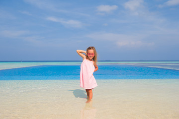 Fototapeta na wymiar Adorable happy smiling little girl during summer vacation