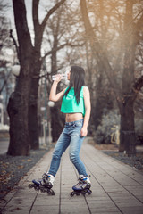 Girl drinking water in park