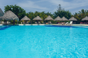 Outdoor resort Swimming pool of luxury hotel in summer spa near
