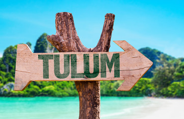 Tulum wooden sign with beach background - obrazy, fototapety, plakaty