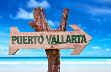 Puerto Vallarta wooden sign with beach background