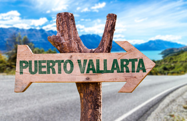 Puerto Vallarta wooden sign with road background