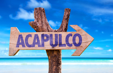 Acapulco wooden sign with beach background