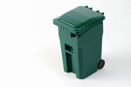 Isolated wheeled green trash can