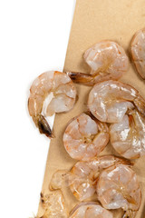 Large raw shrimp on a white background. Selective focus.