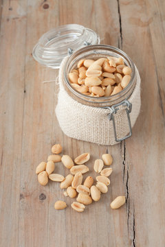 raw peanuts in glass jar