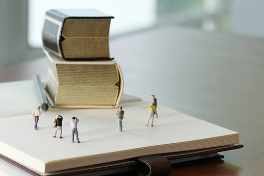 Creative idea concept - miniature photographer with vintage gold