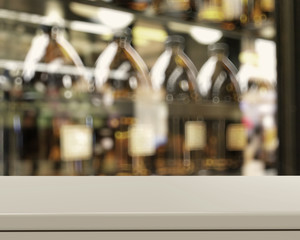 Empty table and blurred vintage bottle with bokeh background, pr