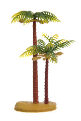 Plastic palm tree toy isolated on white background