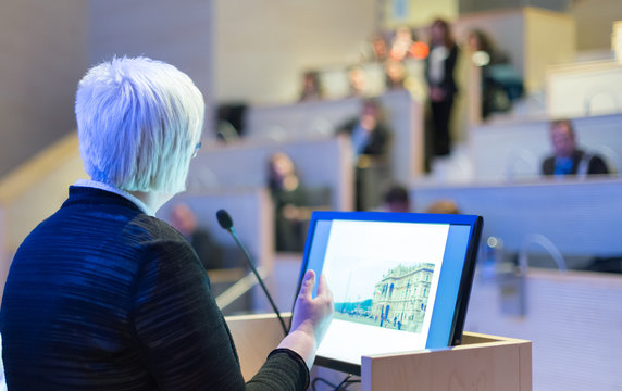 Business woman lecturing at Conference.