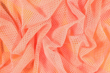 Orange crumpled nonwoven fabric background