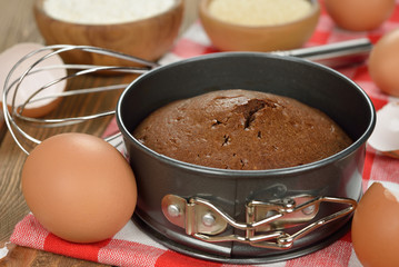 Chocolate cake and ingredients for baking