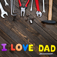 Letters and tools wooden background father's day