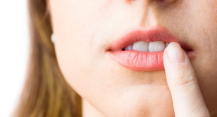 Fototapeta premium Woman pointing to her lips