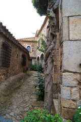 street of the old town between the stone walls