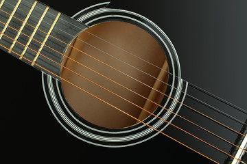 Obraz premium Acoustic guitar on wood background